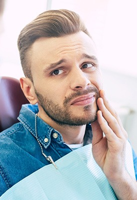 Patient with toothache looking at dentist