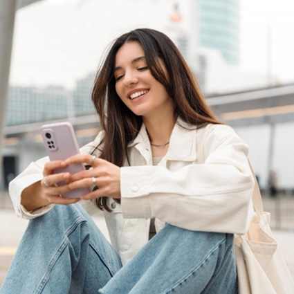 Lady reads something on her phone