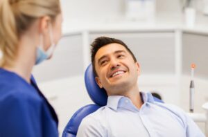 Man smiling after his root canal procedure